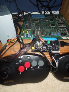 WWF WrestleFest arcade board, ATX power supply, supergun, and Neo Geo controllers.